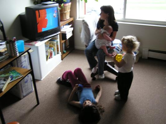 Noah, Malia, Andrea and Sarah watch TV.