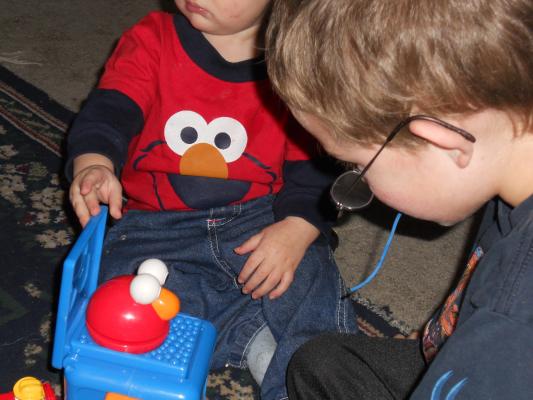 An Elmo Jack-in-the-box from Eder Grandparents. Look in Matches Joshua's shirt. 