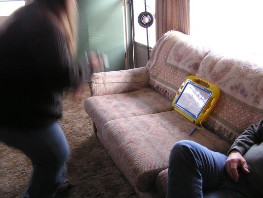 Jamie does a dance in front of Noah's magnadoodle.