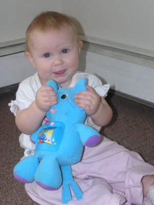 Sarah plays with her new elephant.