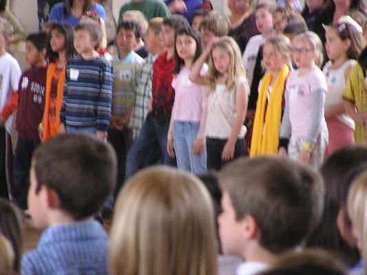 Malia singing with her school