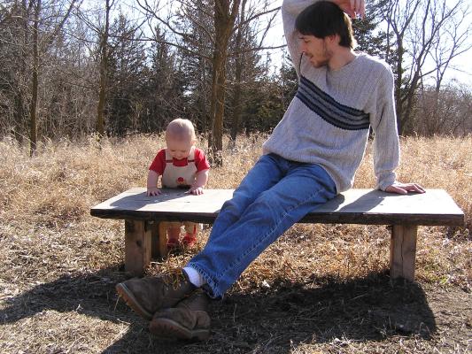 David is trying to get Noah to look up, not smelling his armpit.