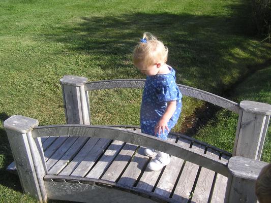 Sarah plays on a bridge