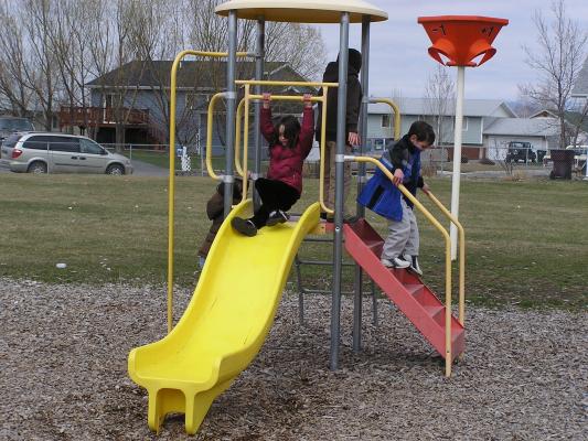 Kids play at the park before the Easter egg hunt.