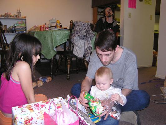 Sarah and David open presents.
