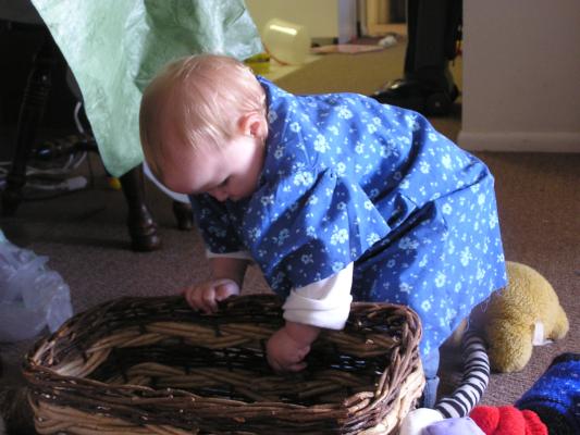 Sarah plays with a basket.