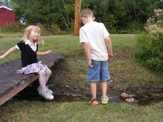 Sarah and Noah playing in the creek at Little Rockies.