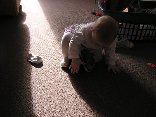 Sarah plays with shoes.