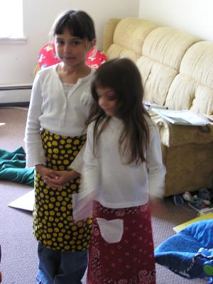 Malia and Andrea wear their new aprons.