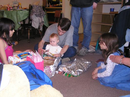 Sarah and David open presents.