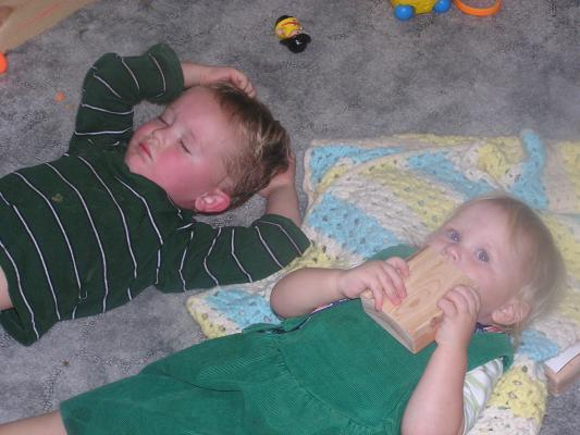 Noah sleeping and Sarh lieing down with him.