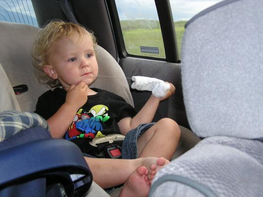Noah eats a thread from his sock.