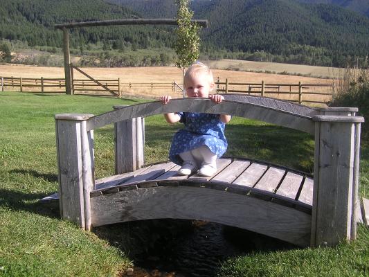 Sarah plays on a bridge