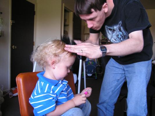 Noah gets a hair cut.
