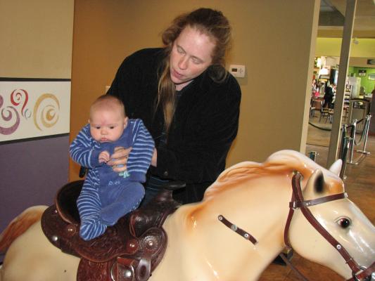Joshua rides the horse.