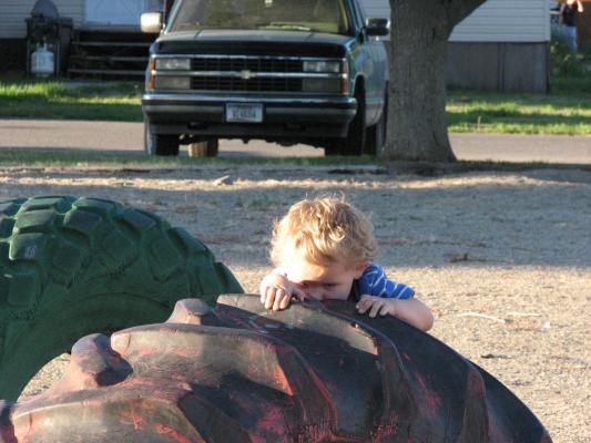 Noah by the red tire.