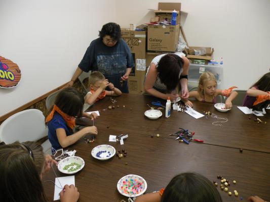 Orange Aspens at the craft table.