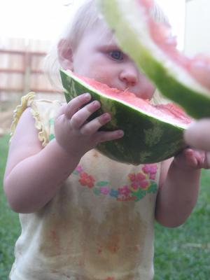Sarah eats some watermelon.