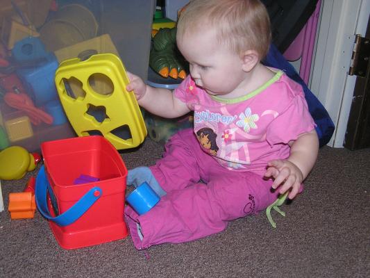 Sarah plays with her new shapes.