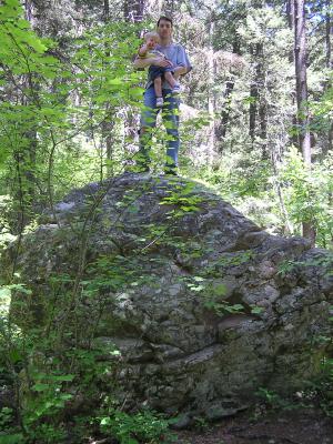 David and Noah on top of a big rock.