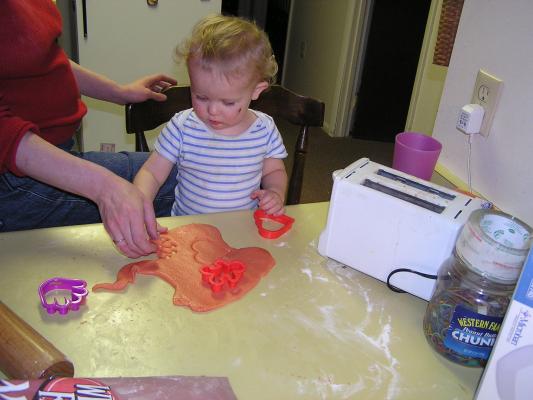 Noah cuts out sugar cookies for Valentines Day.