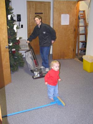 Joe and Noah clean up after the Christmas Eve service.