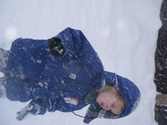 Noah plays in the snow.
