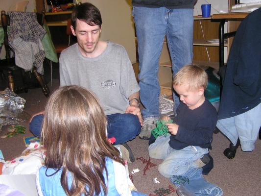 The kids play with the animals.