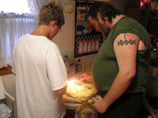 Joe and Benji lite Katie's 28th birthday cake