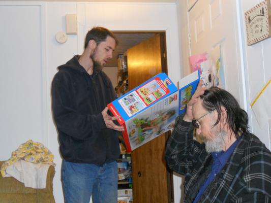 David looks at the box. 