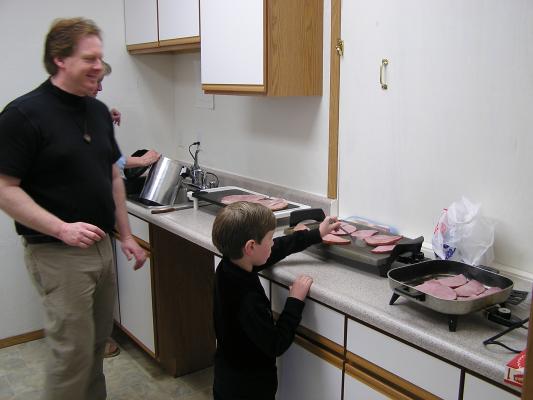 The guys cooked Easter breakfast.
Max and his dad cook some ham.