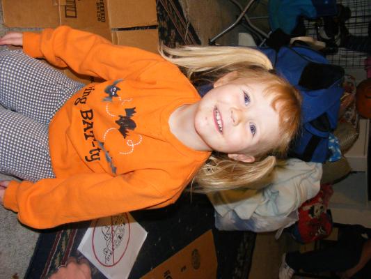 Sarah on Halloween in orange.
