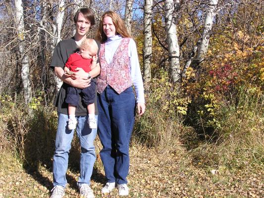 Family portrait in the woods.