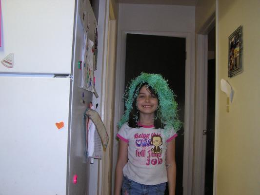 Malia with green hair.