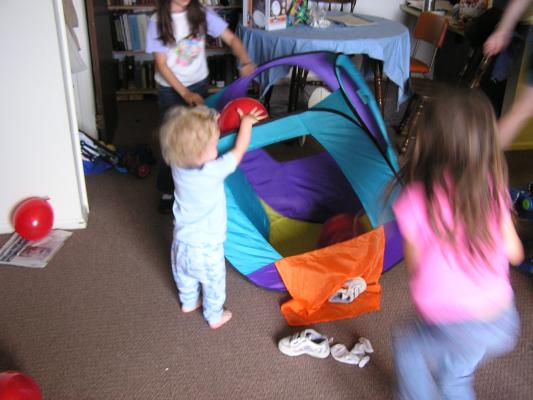 Noah and Andrea play with balloons.