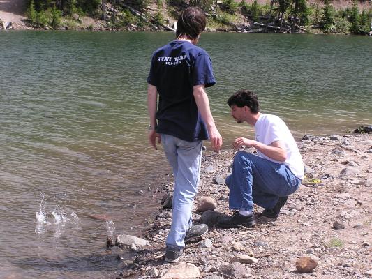 David and Myke throw some rocks.