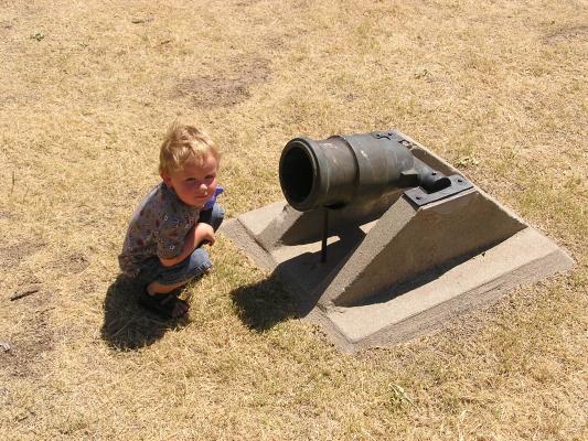 Noah looks at a canon.