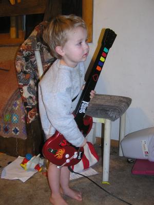 Noah plays guitair hero.