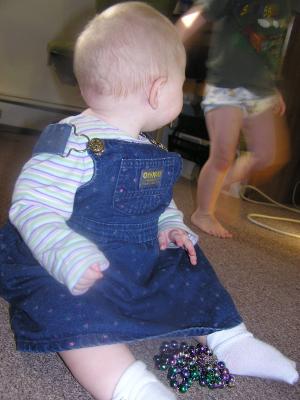 Sarah watches Noah dance.