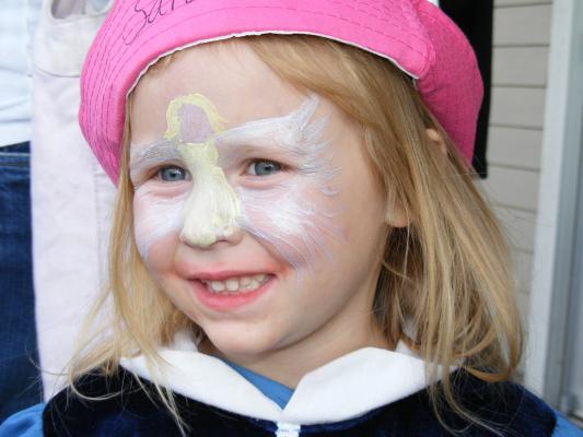 Sarah with an angel painted on her face by Miss. Katie G.