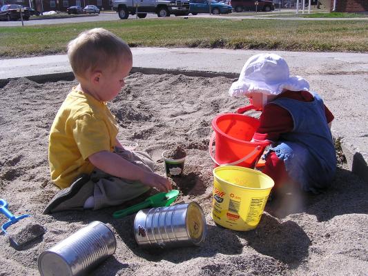 Noah and Sarah play in the sand