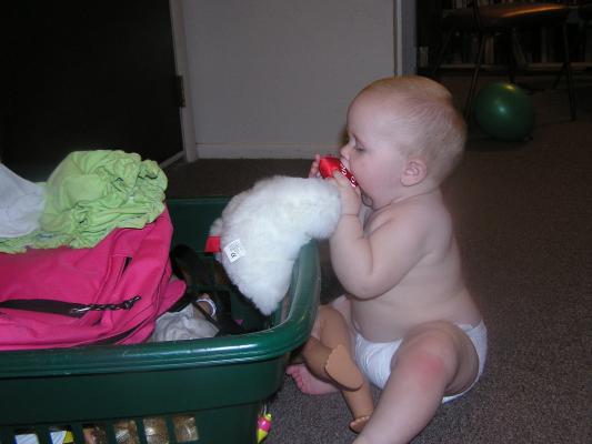 Sarah tastes each toy to see which is the best.