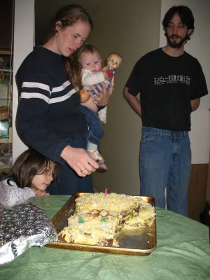 Katie torches the cake.