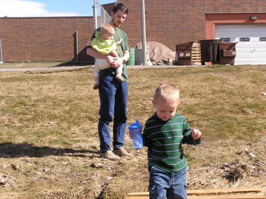 Noah found a cool bridge. Sarah and David watch him walk accross it.