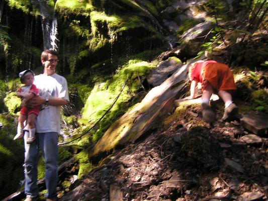 Sarah and David watch Noah hike