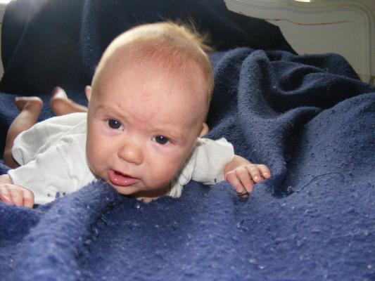 Joshua in a blue blanket.