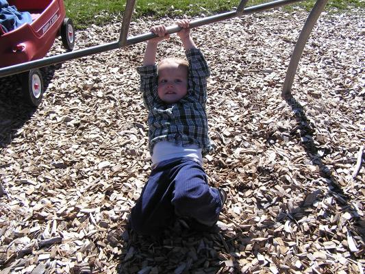 Noah plays at the park by the grocery store