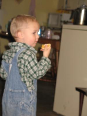 Noah eats a snack.