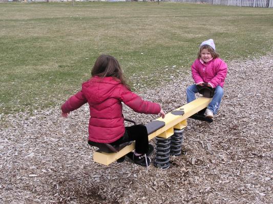 Kids play at the park before the Easter egg hunt.