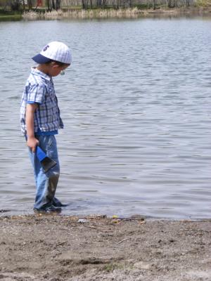 Noah plays in the water at Bozeman Pond.